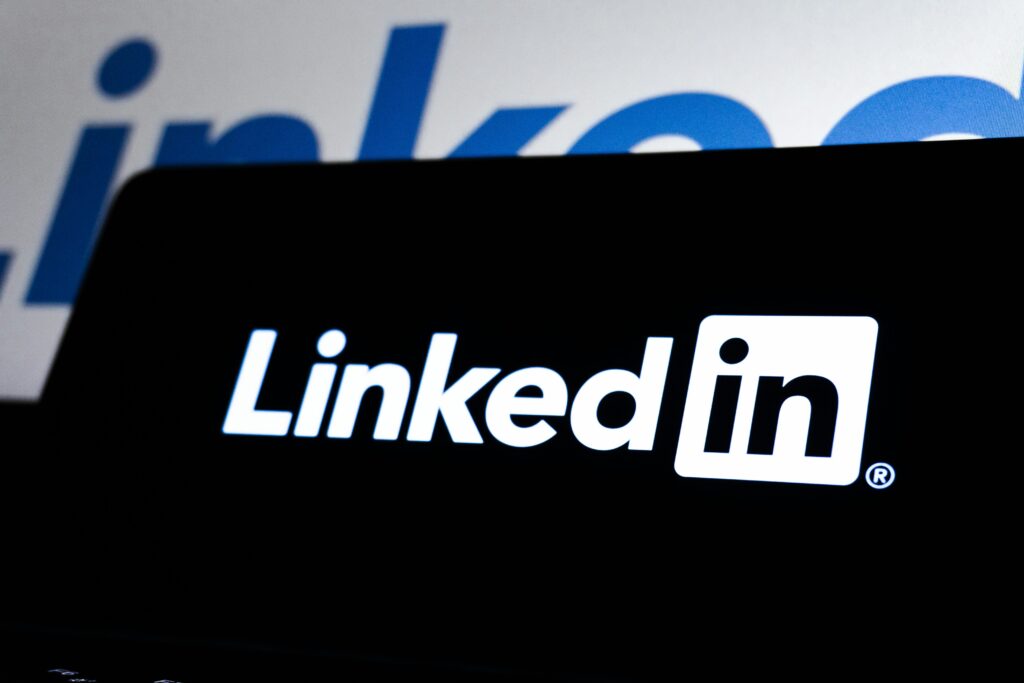 High contrast image of LinkedIn logo displayed prominently on a dark screen.